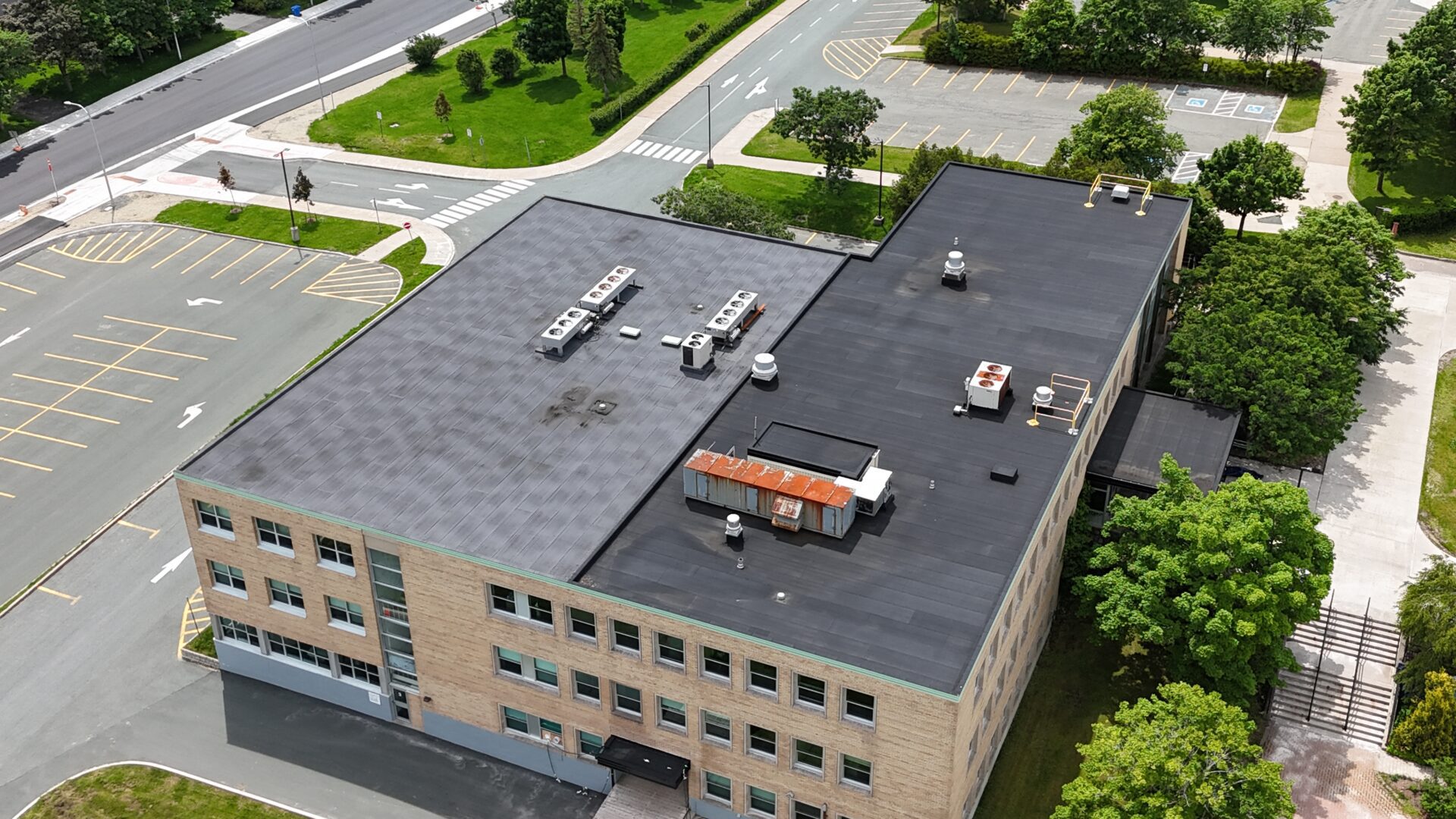 MUN Math Building 1 Aerial view of a large building showcasing its expansive roof and surrounding landscape